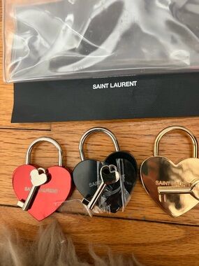 Saint Laurent lock and key . Brand new from Paris .Authentic and never used.